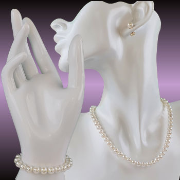 white pearl necklace bracelet and earrings